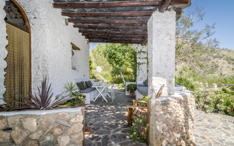 Doors opening to shaded terraces
